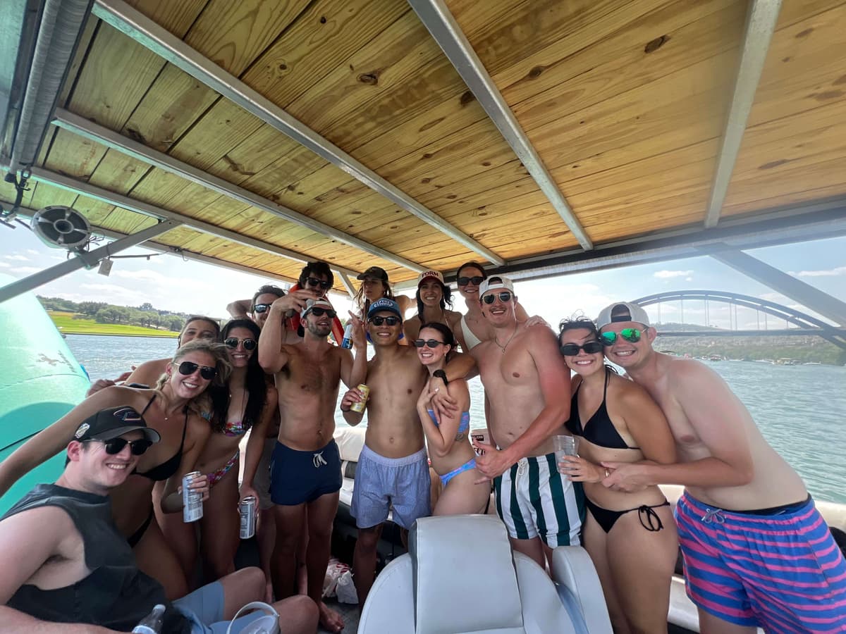 Large group party on BOATX boat Lake Austin with 360 bridge Austin Texas